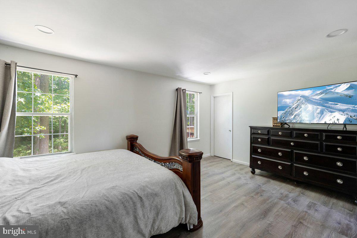 8275 Maple Avenue Pennsauken, NJ 08109 - Photo 13 of 43 a bedroom with a bed and a flat screen tv