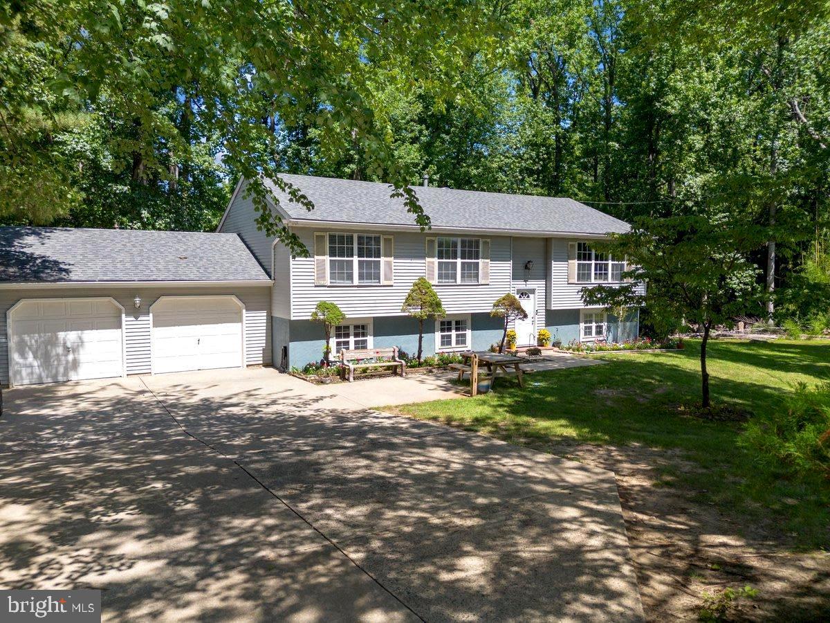 8275 Maple Avenue Pennsauken, NJ 08109 - Photo 2 of 43 a front view of a house with a garden