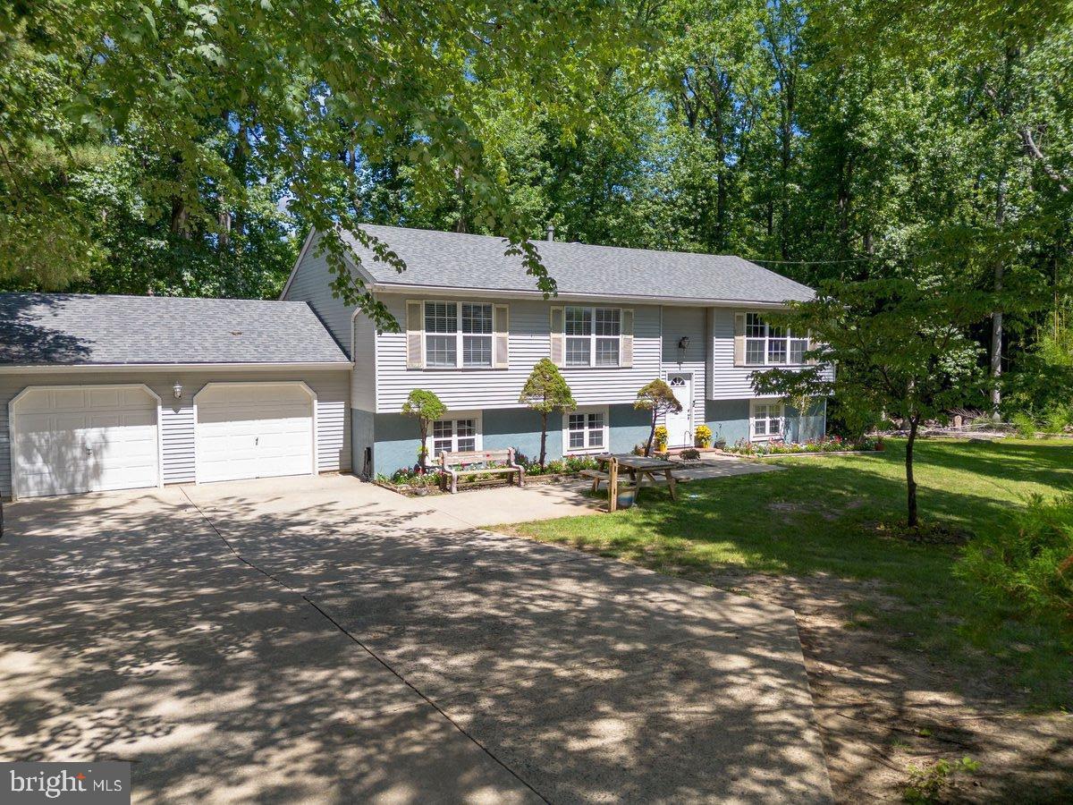 8275 Maple Avenue Pennsauken, NJ 08109 - Photo 21 of 43 a front view of a house with a garden