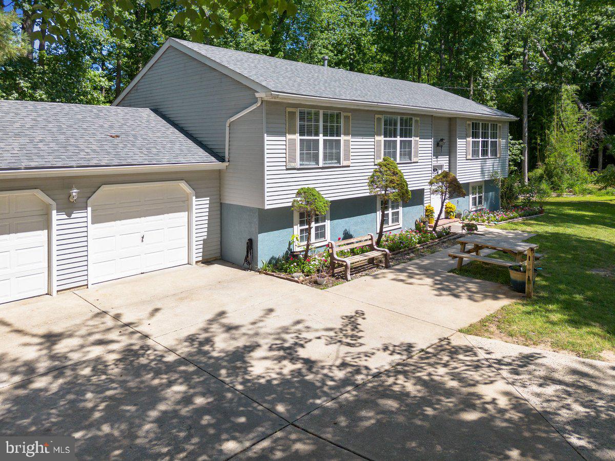 8275 Maple Avenue Pennsauken, NJ 08109 - Photo 23 of 43 a front view of a house with yard and seating space