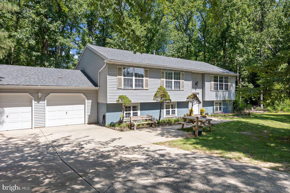 8275 Maple Avenue Pennsauken, NJ 08109 - Photo 29 of 43 a front view of a house with garden