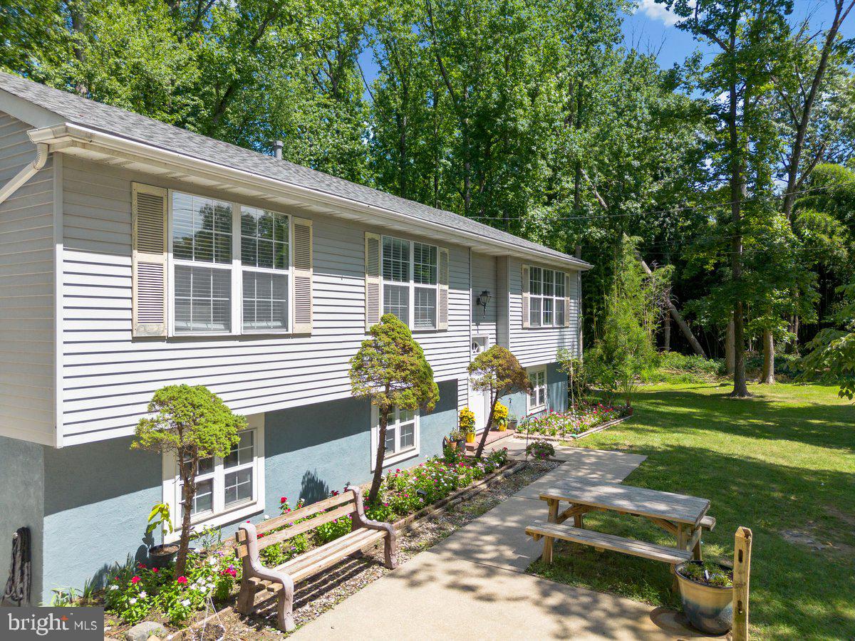 8275 Maple Avenue Pennsauken, NJ 08109 - Photo 30 of 43 a front view of a house with garden