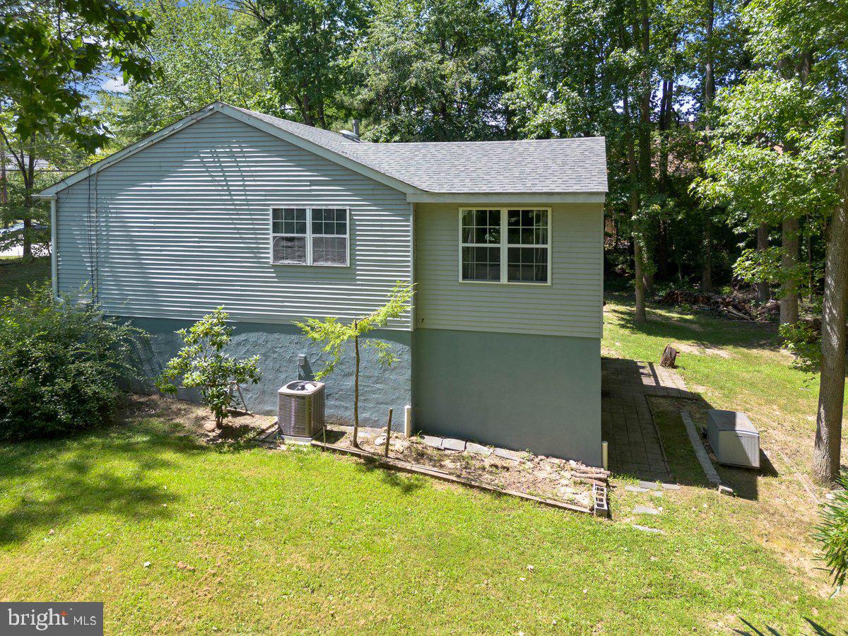 8275 Maple Avenue Pennsauken, NJ 08109 - Photo 33 of 43 a front view of a house with a yard