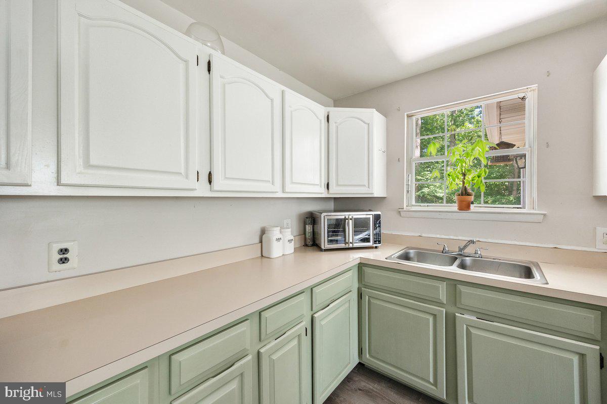 8275 Maple Avenue Pennsauken, NJ 08109 - Photo 8 of 43 a kitchen with stainless steel appliances white cabinets and a sink