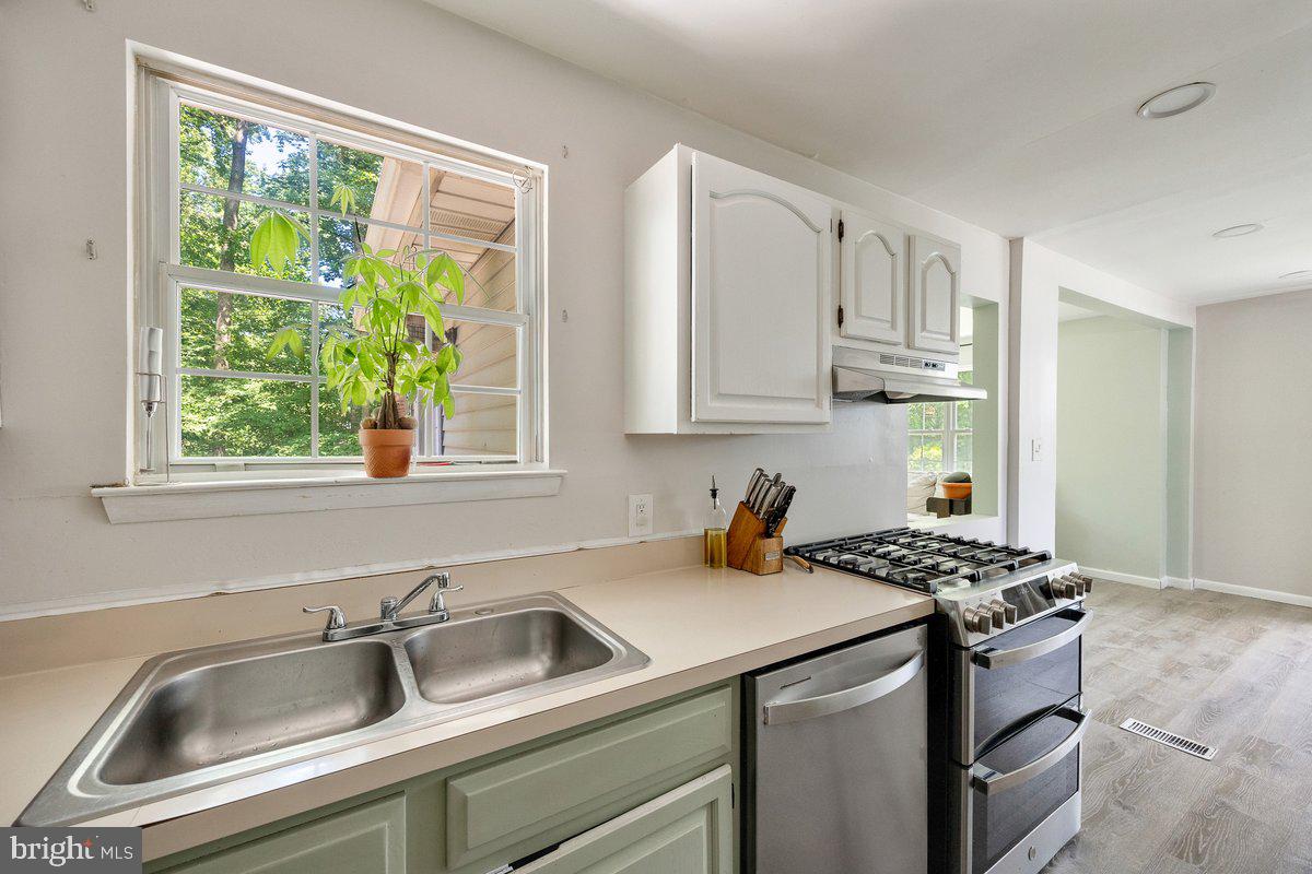 8275 Maple Avenue Pennsauken, NJ 08109 - Photo 9 of 43 a kitchen that has a sink and a window