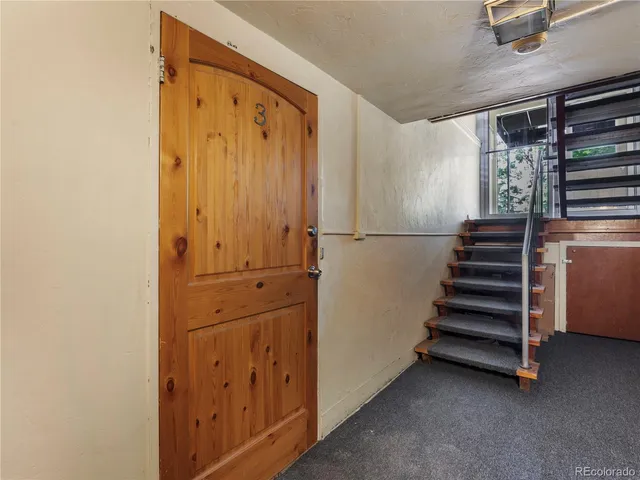 a view of an entryway with stairs