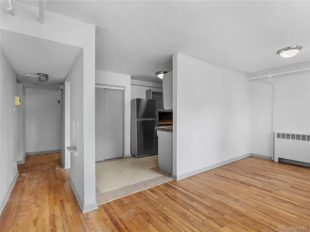 a view of a livingroom with wooden floor