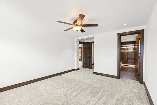 a bathroom with a sink a toilet a mirror and shower