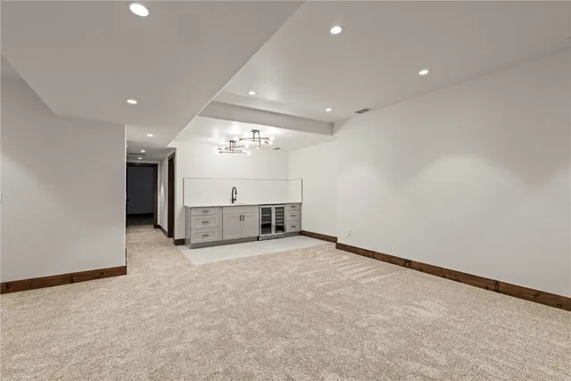 a view of a hallway with chandelier