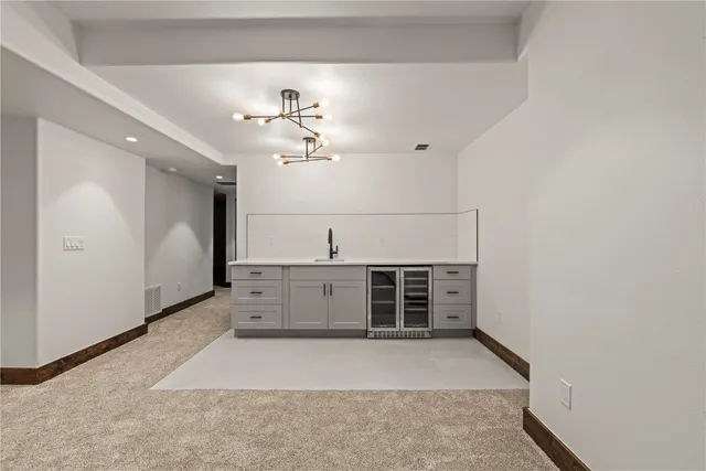 a view of an empty room and a window