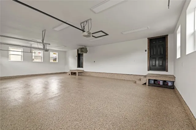 an aerial view of a house with a lake view