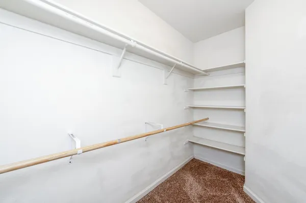 a view of an empty walk in closet