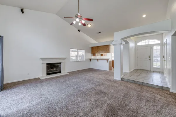 a view of a kitchen with a sink and a stove top oven