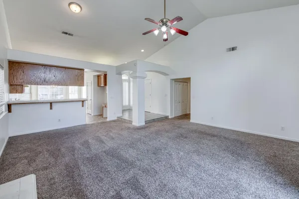a view of an empty room with a window