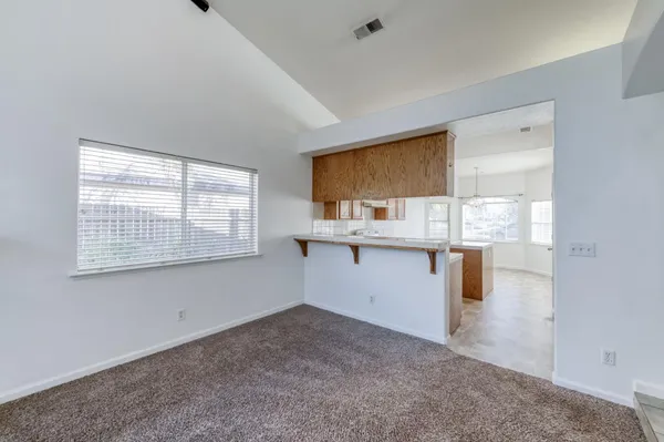a room with a stove top oven cabinetry