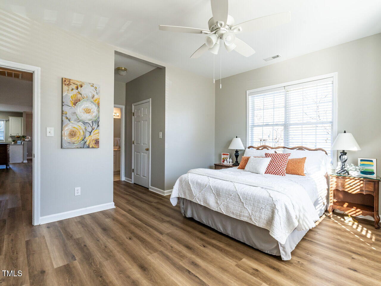 2740 Andover Glen Road Raleigh, NC 27604 - Photo 11 of 20 a bedroom with a bed and wooden floor