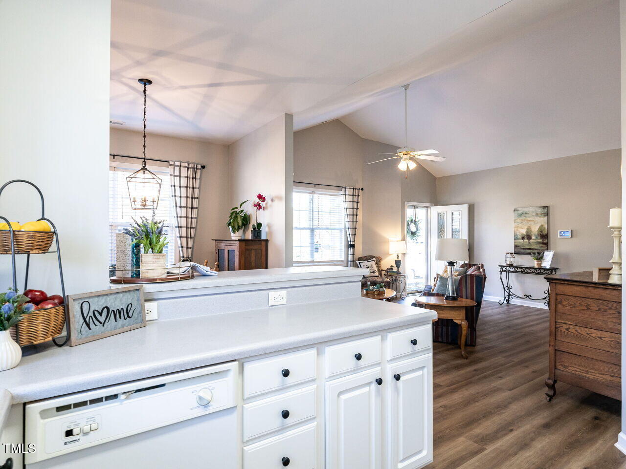 2740 Andover Glen Road Raleigh, NC 27604 - Photo 9 of 20 a kitchen with kitchen island white cabinets and wooden floor