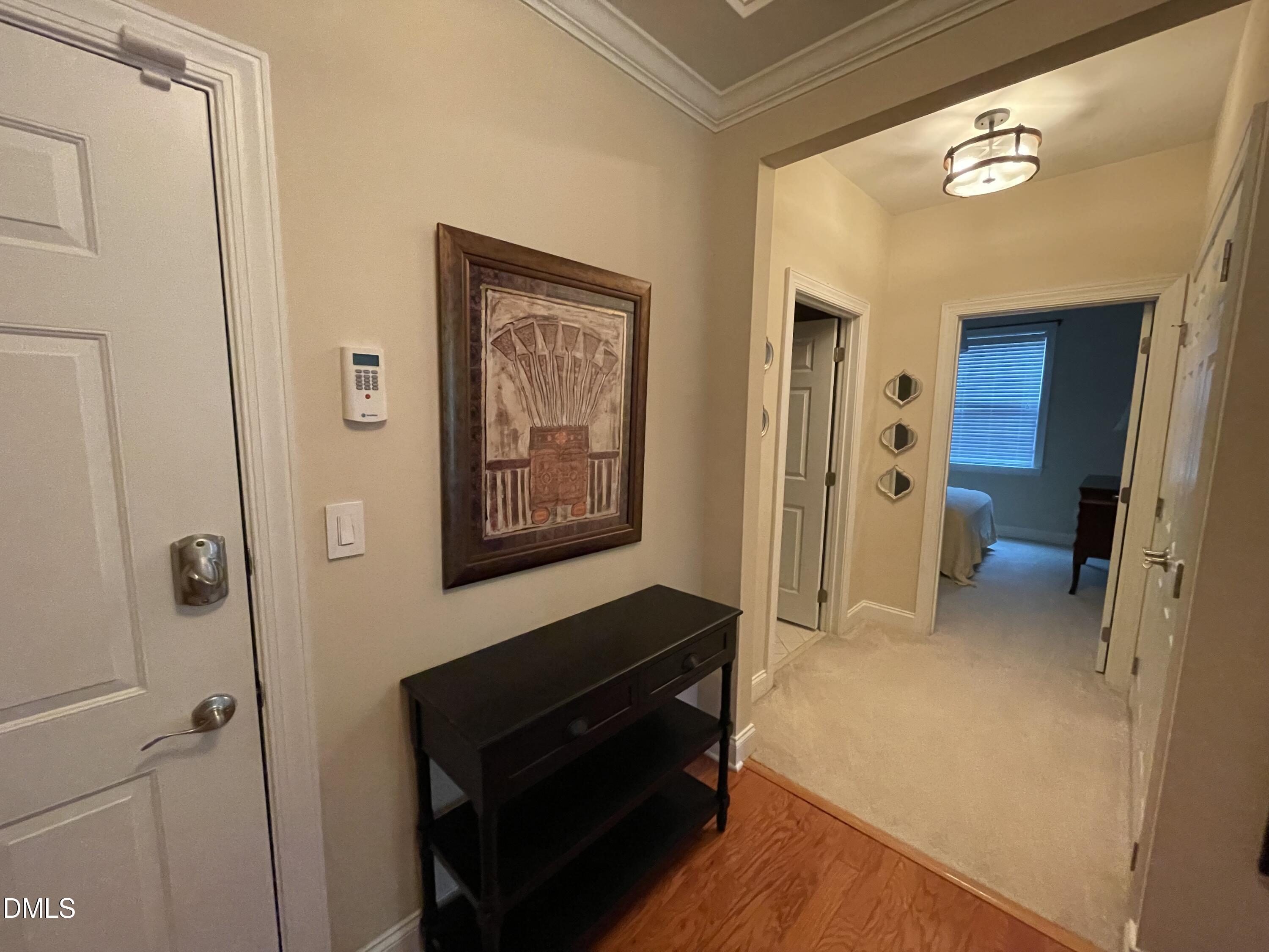 10411 Rosegate Court, Unit 3 Raleigh, NC 27617 - Photo 36 of 62 a view of a livingroom with wooden floor and staircase