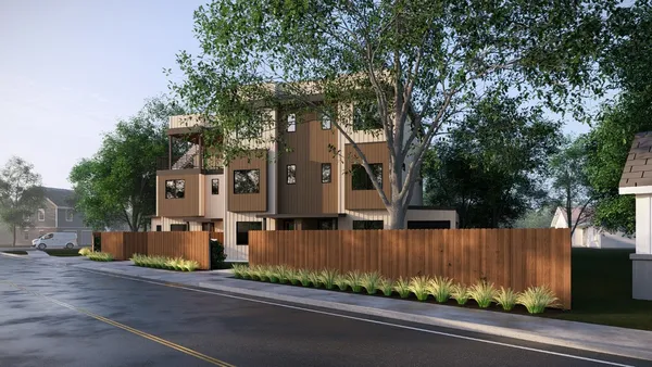 front view of a house with a tree