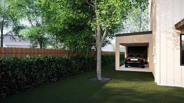 a view of a porch with furniture and garden