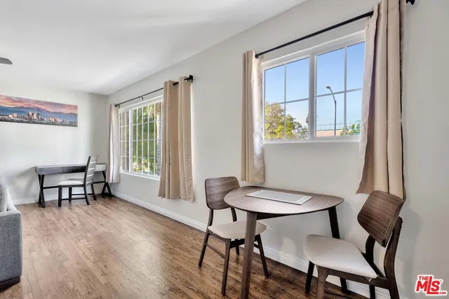 a view of a dining room with furniture window and outside view
