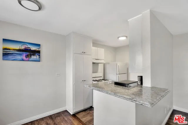 a kitchen with stainless steel appliances granite countertop a sink and cabinets