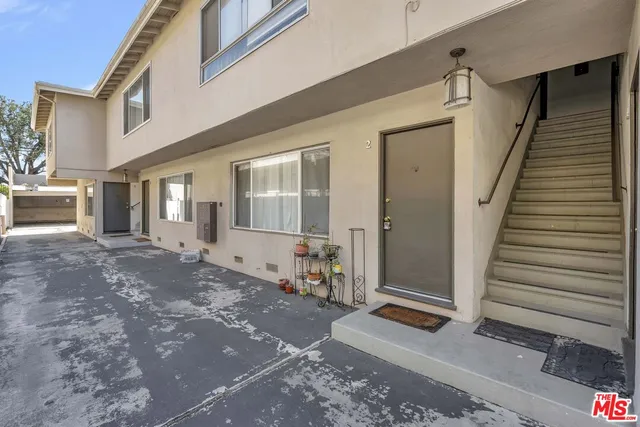 a view of a house with entrance gate