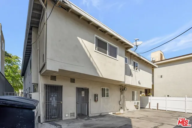a view of a garage and car parked