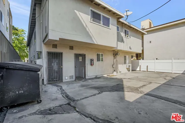 a view of garage with a car parked in it
