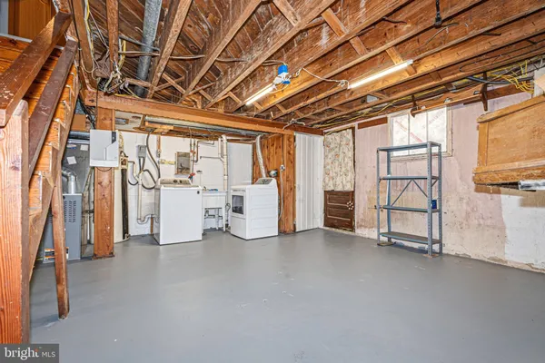 a view of an empty room with white walls