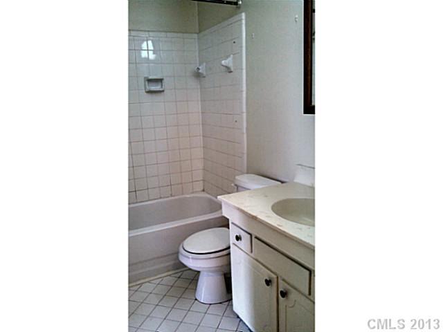 5817 F Hunting Ridge Lane Charlotte, NC 28212 - Photo 10 of 12 a bathroom with a sink a toilet and bathtub