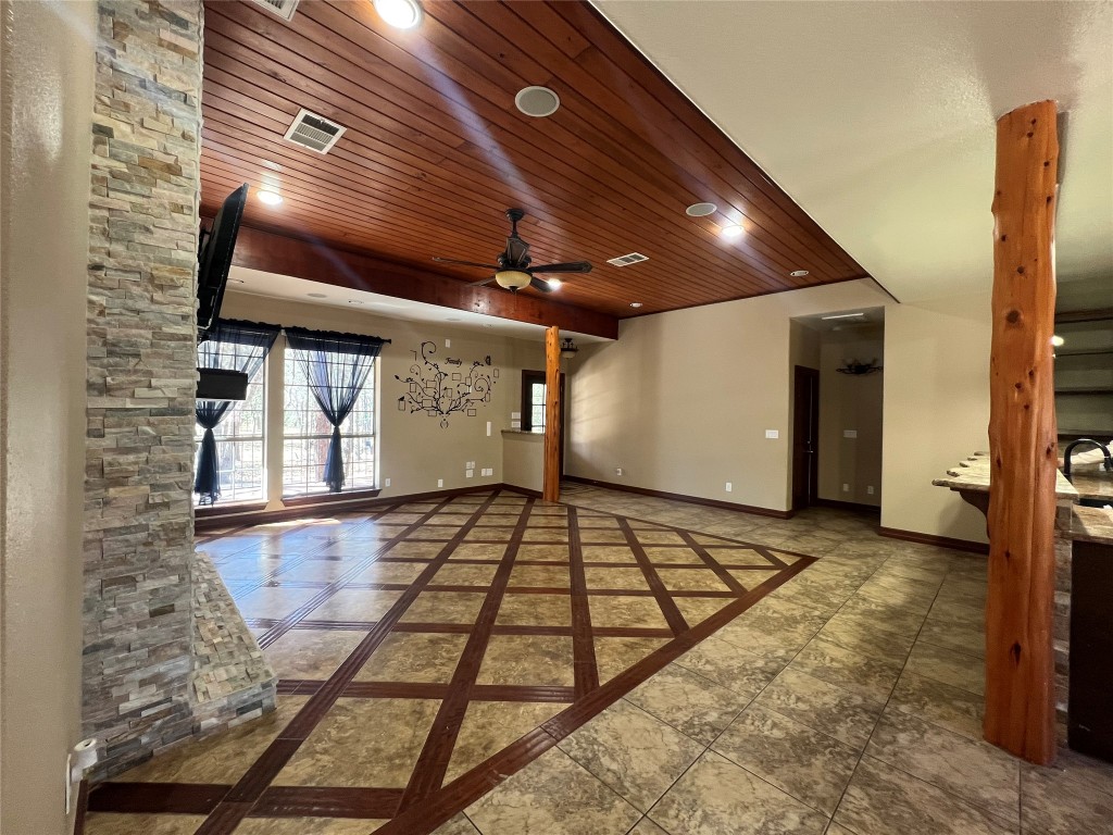 665 Wilson Road Red Rock, TX 78662 - Photo 15 of 34 Empty room featuring inlaid floor details, wood ceiling, recessed lighting, and a ceiling fan