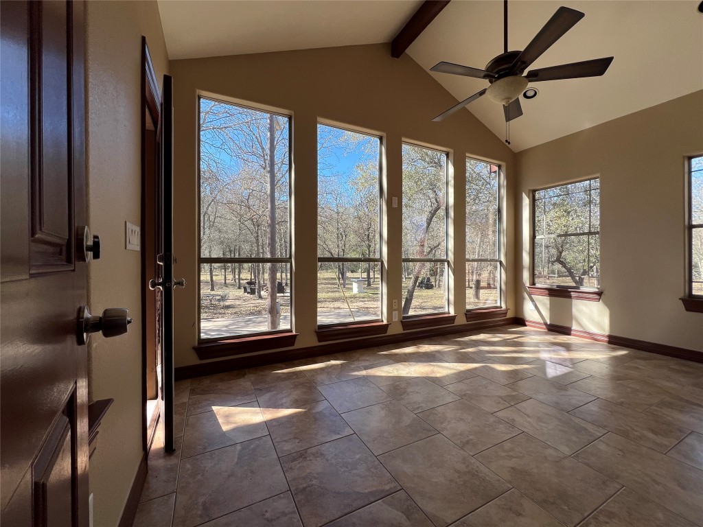 665 Wilson Road Red Rock, TX 78662 - Photo 27 of 34 Unfurnished sunroom with beam ceiling and high vaulted ceiling
