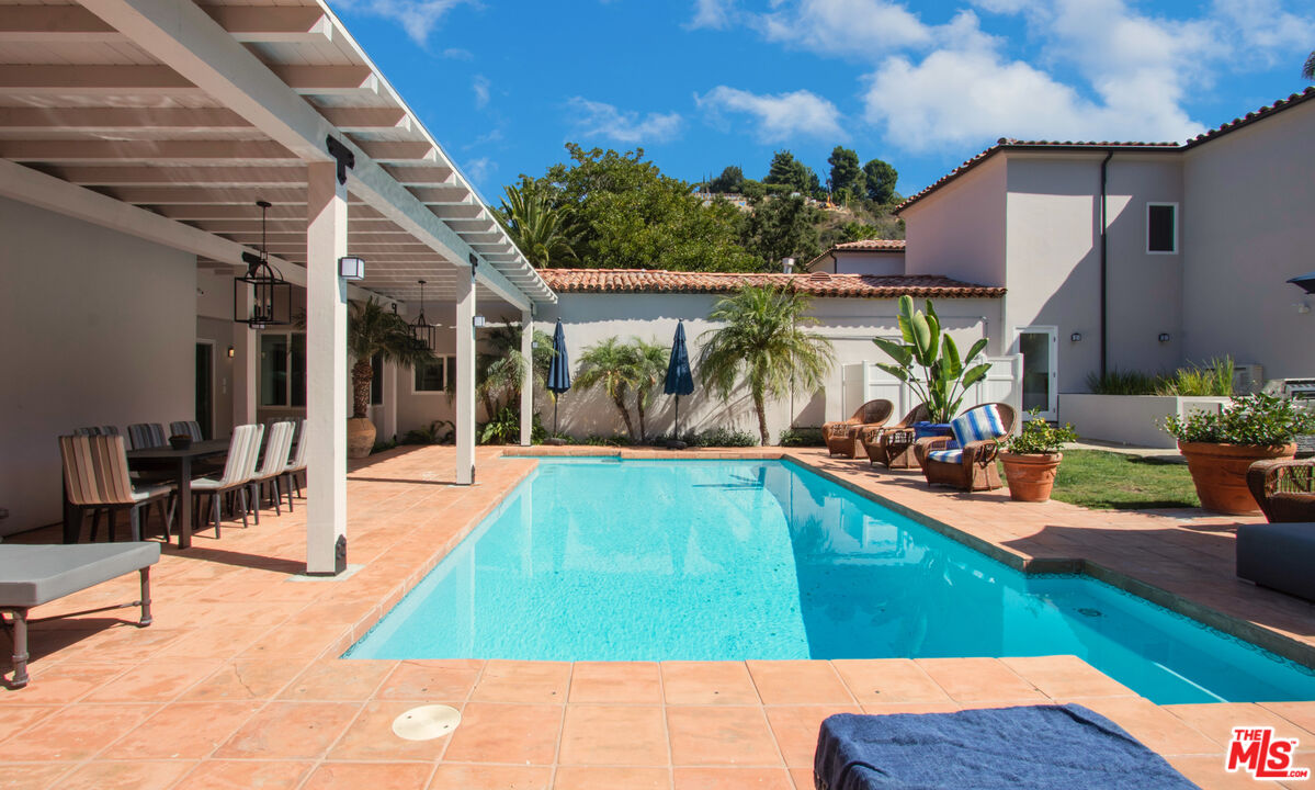 9696 Antelope Road Beverly Hills, CA 90210 - Photo 2 of 3 a view of a backyard with swimming pool and sitting area