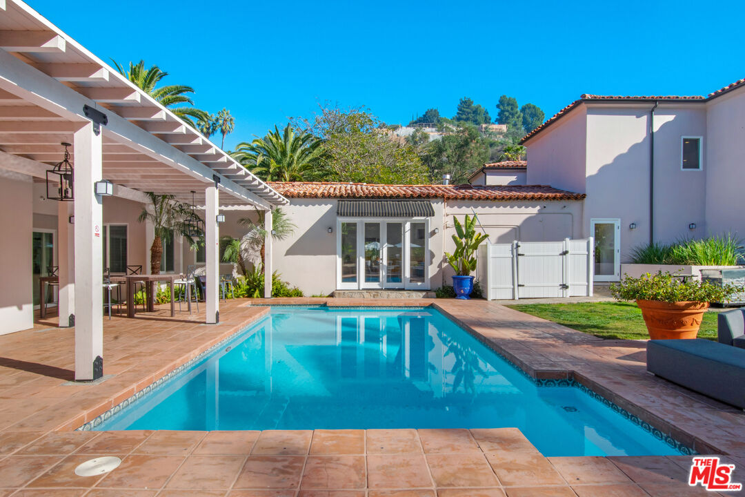 9696 Antelope Road Beverly Hills, CA 90210 - Photo 3 of 3 a view of a house with swimming pool