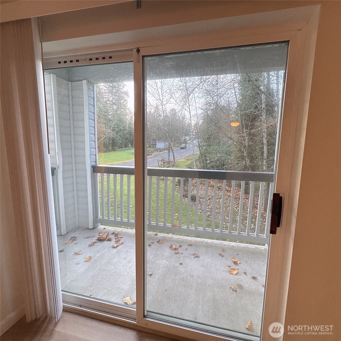 33020 10th Avenue Southwest, Unit A201 Federal Way, WA 98023 - Photo 7 of 15 a view of a glass door with a glass door
