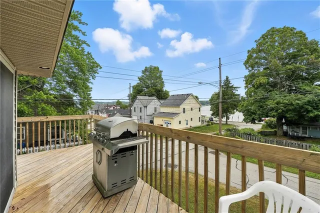 a view of a balcony with wooden floor