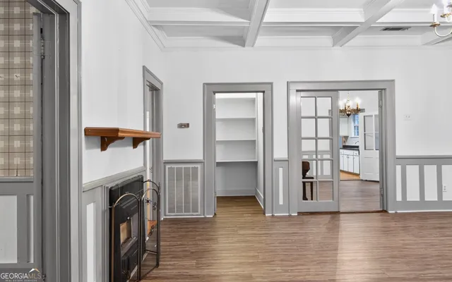 a kitchen with granite countertop a refrigerator and a sink