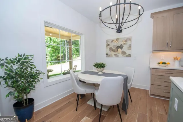 a view of a dining room with furniture window and wooden floor