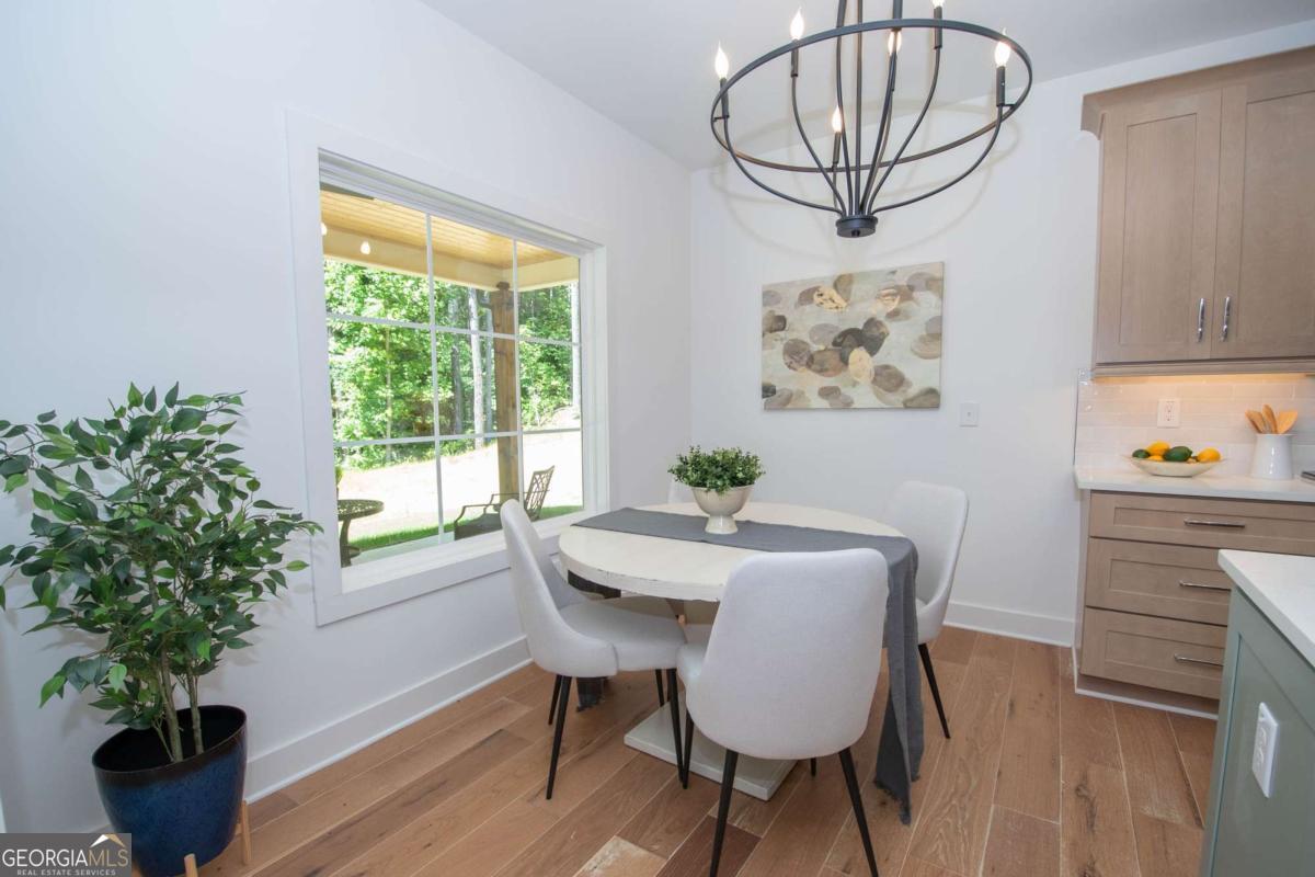 5 Firefly Run LaGrange, GA 30240 - Photo 23 of 53 a view of a dining room with furniture window and wooden floor