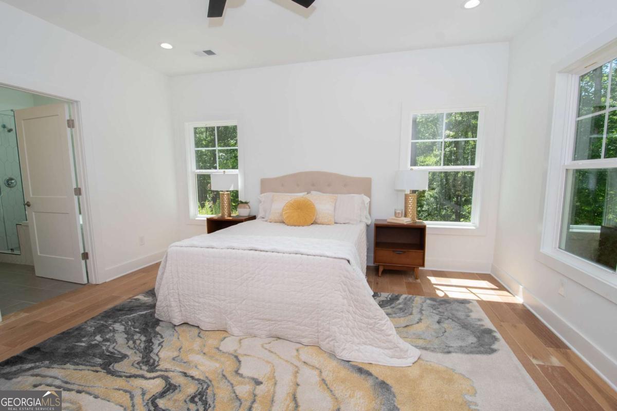 5 Firefly Run LaGrange, GA 30240 - Photo 27 of 53 a bedroom with a large bed and a large window