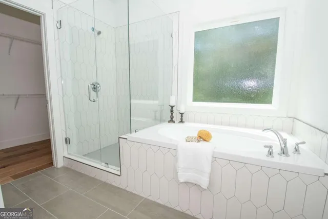 a bathroom with a sink a mirror and shower