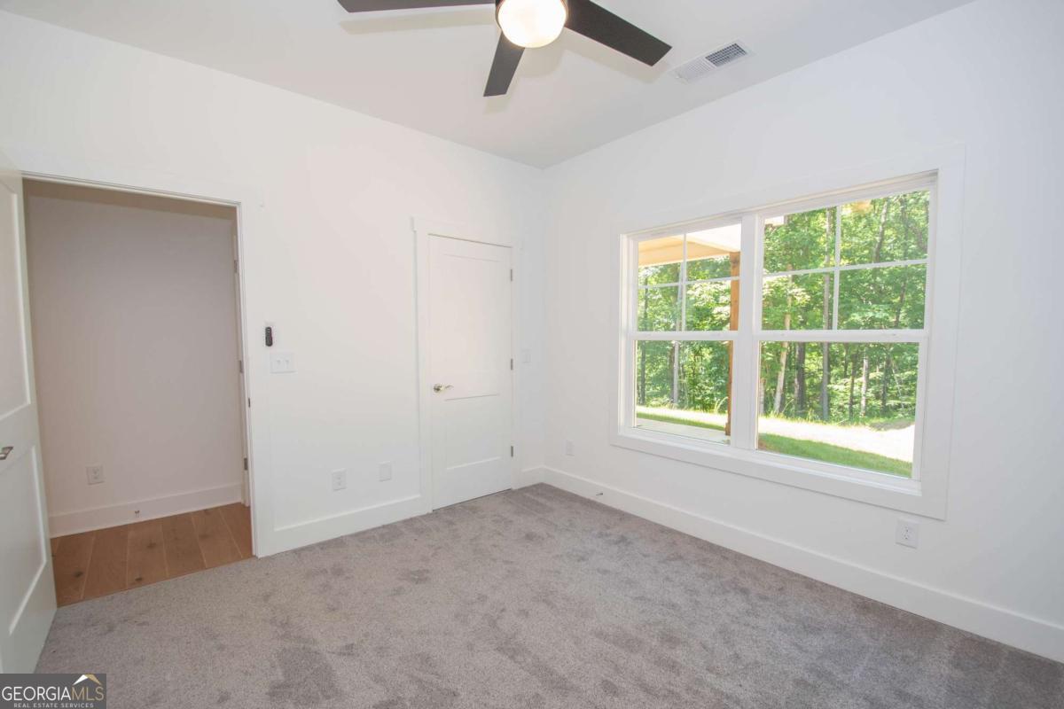 5 Firefly Run LaGrange, GA 30240 - Photo 36 of 53 an empty room with a window and a fan