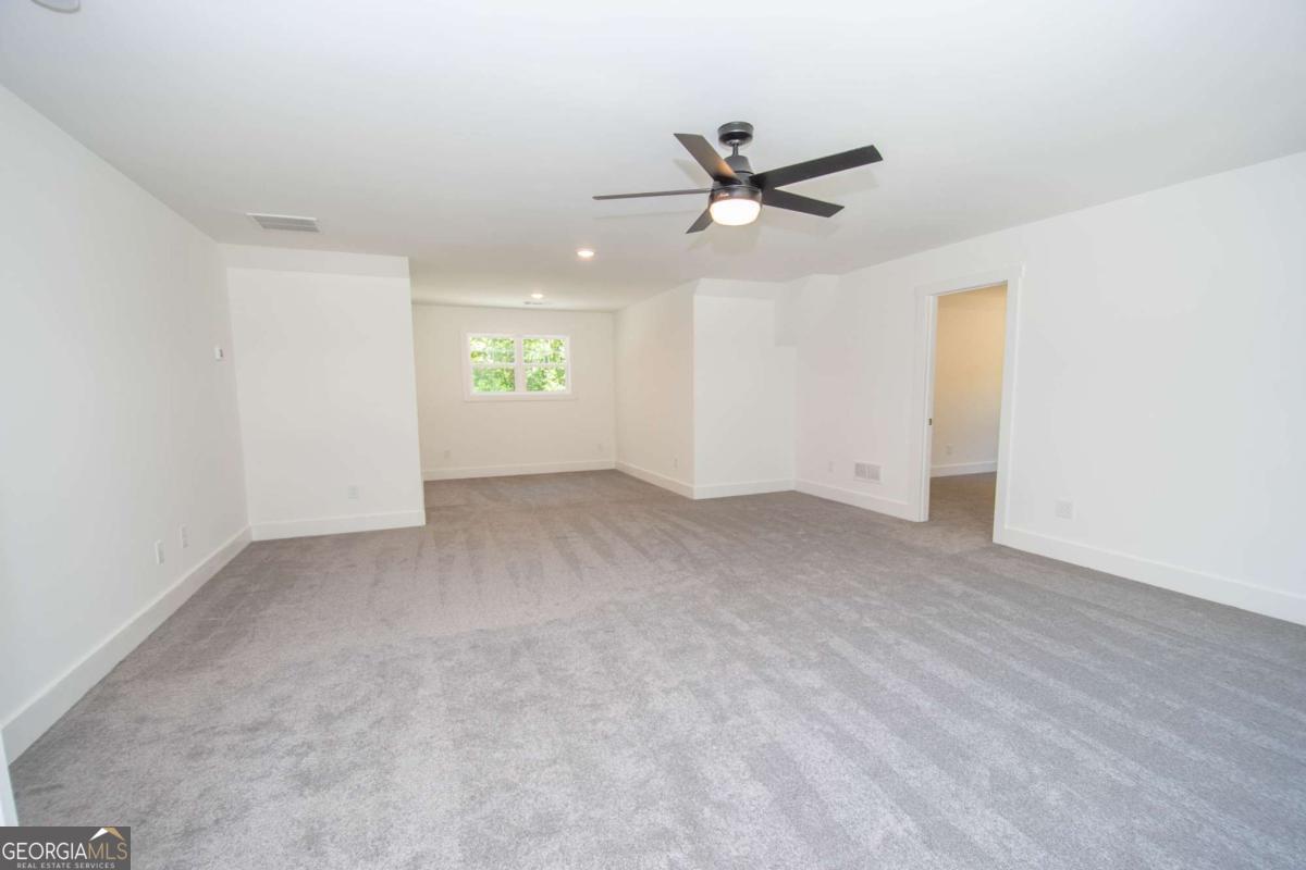 5 Firefly Run LaGrange, GA 30240 - Photo 42 of 53 a view of a big room with wooden floor closet and windows