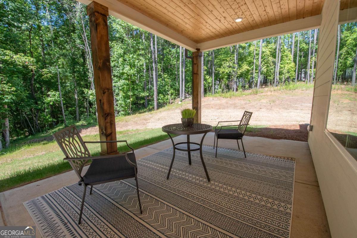 5 Firefly Run LaGrange, GA 30240 - Photo 48 of 53 a view of a porch with furniture and wooden floor