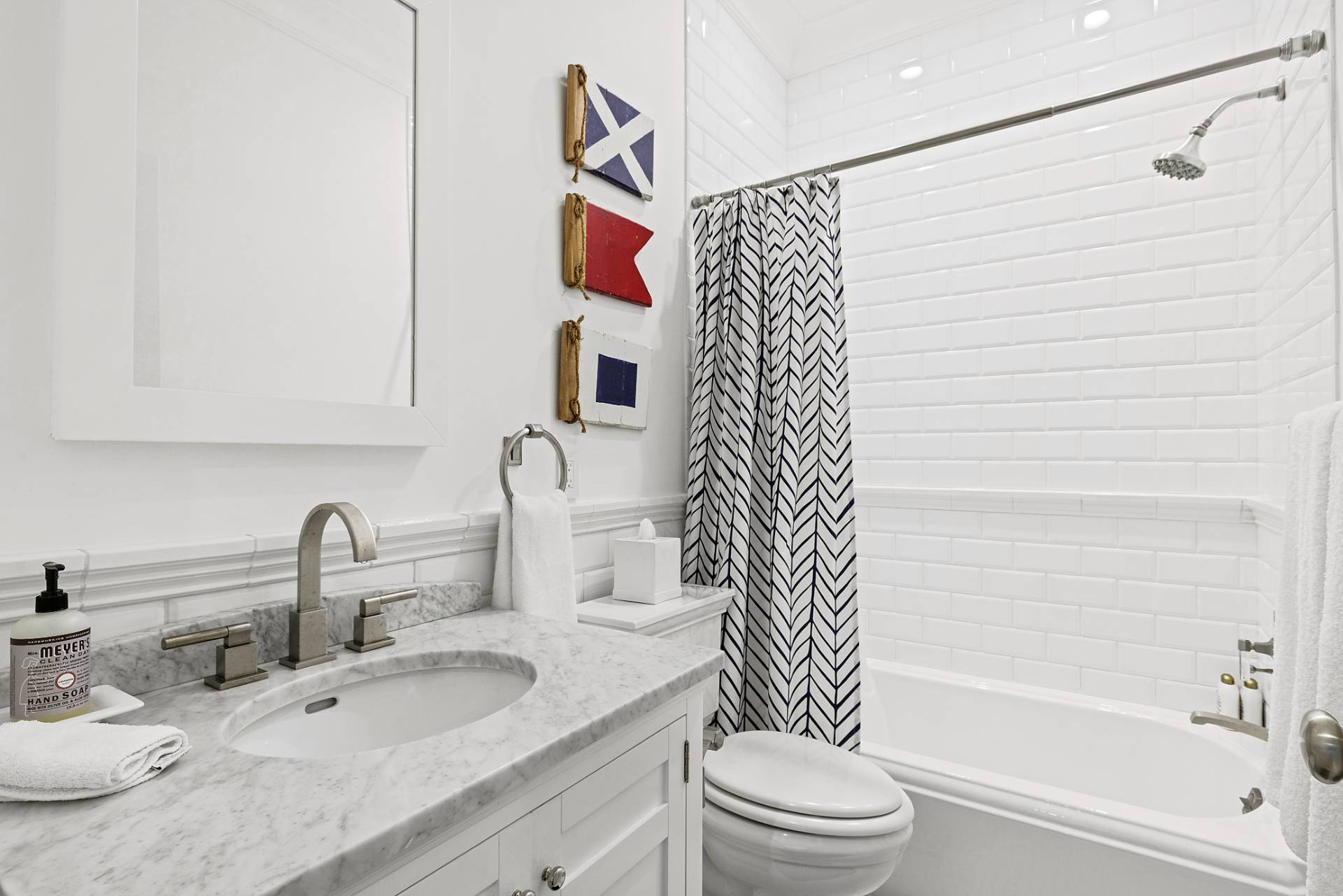 272 Old Montauk Highway Montauk, NY 11954 - Photo 16 of 25 a bathroom with a sink and a mirror