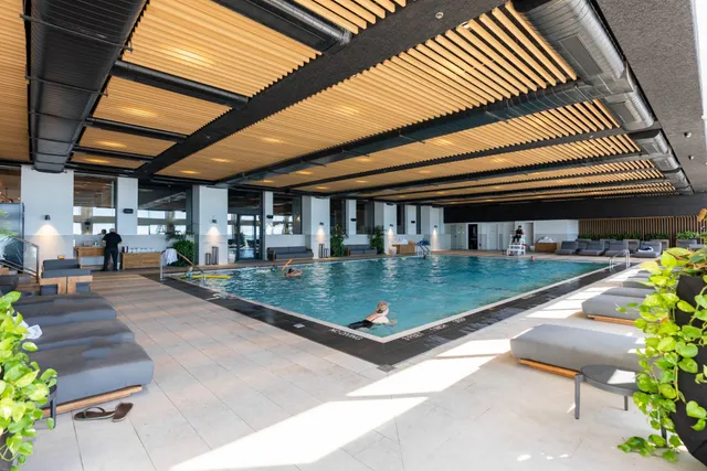 a view of swimming pool with outdoor seating