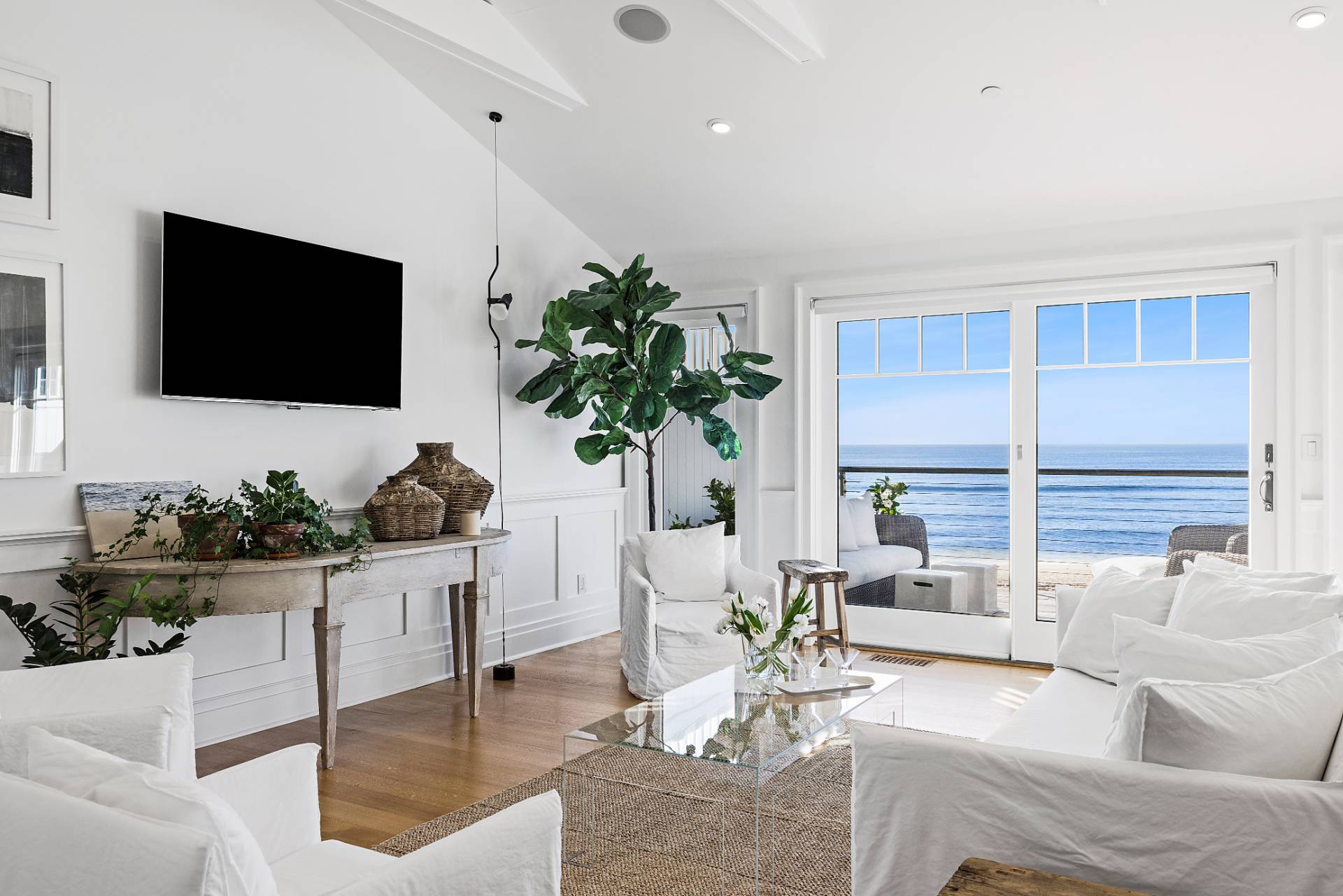 272 Old Montauk Highway Montauk, NY 11954 - Photo 3 of 25 a living room with furniture and a flat screen tv
