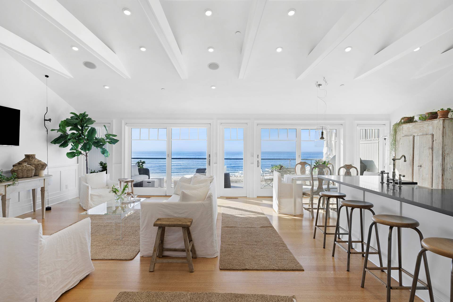 272 Old Montauk Highway Montauk, NY 11954 - Photo 4 of 25 a view of a dining room with furniture window and wooden floor