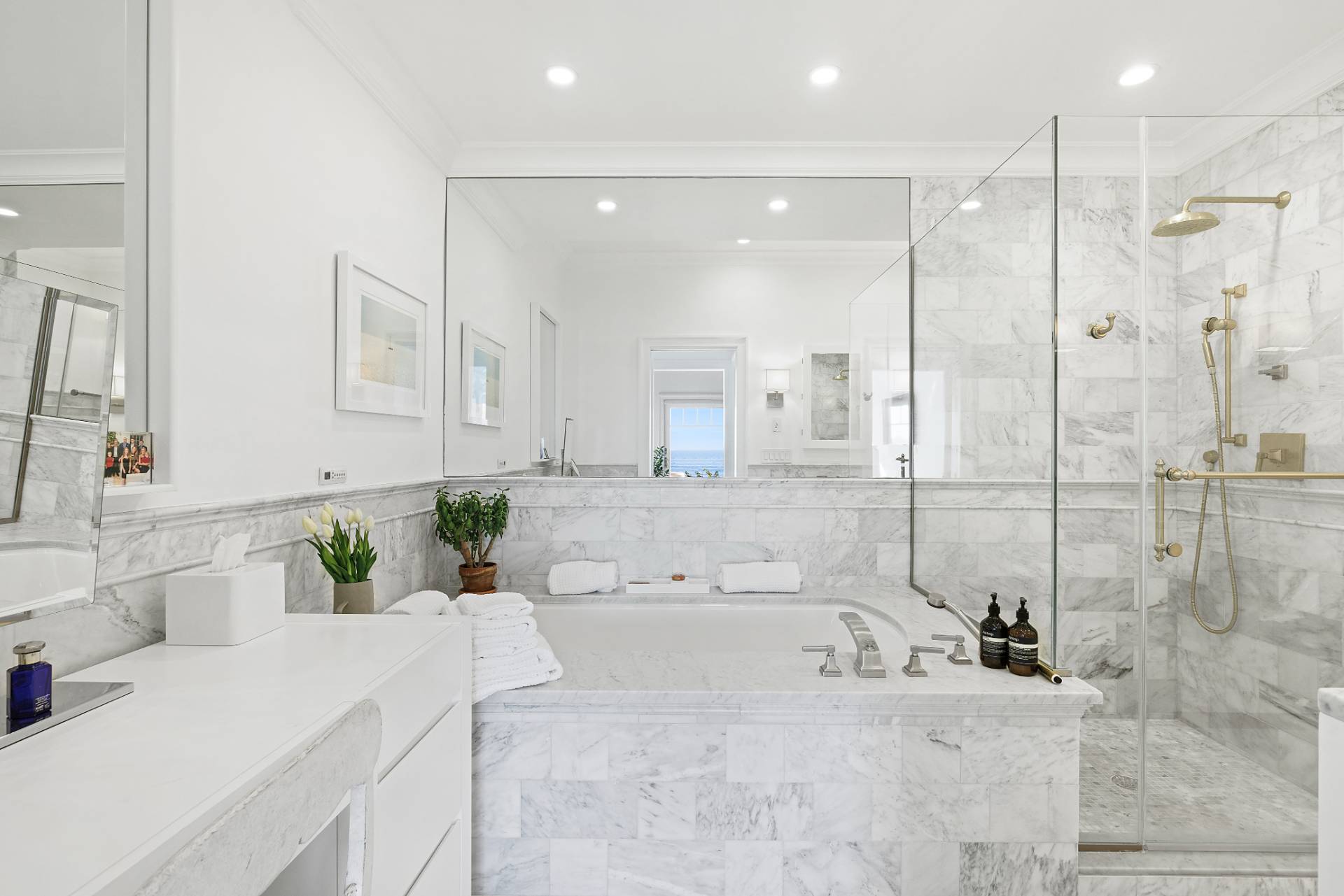 272 Old Montauk Highway Montauk, NY 11954 - Photo 10 of 25 a bathroom with a double vanity sink mirror and shower
